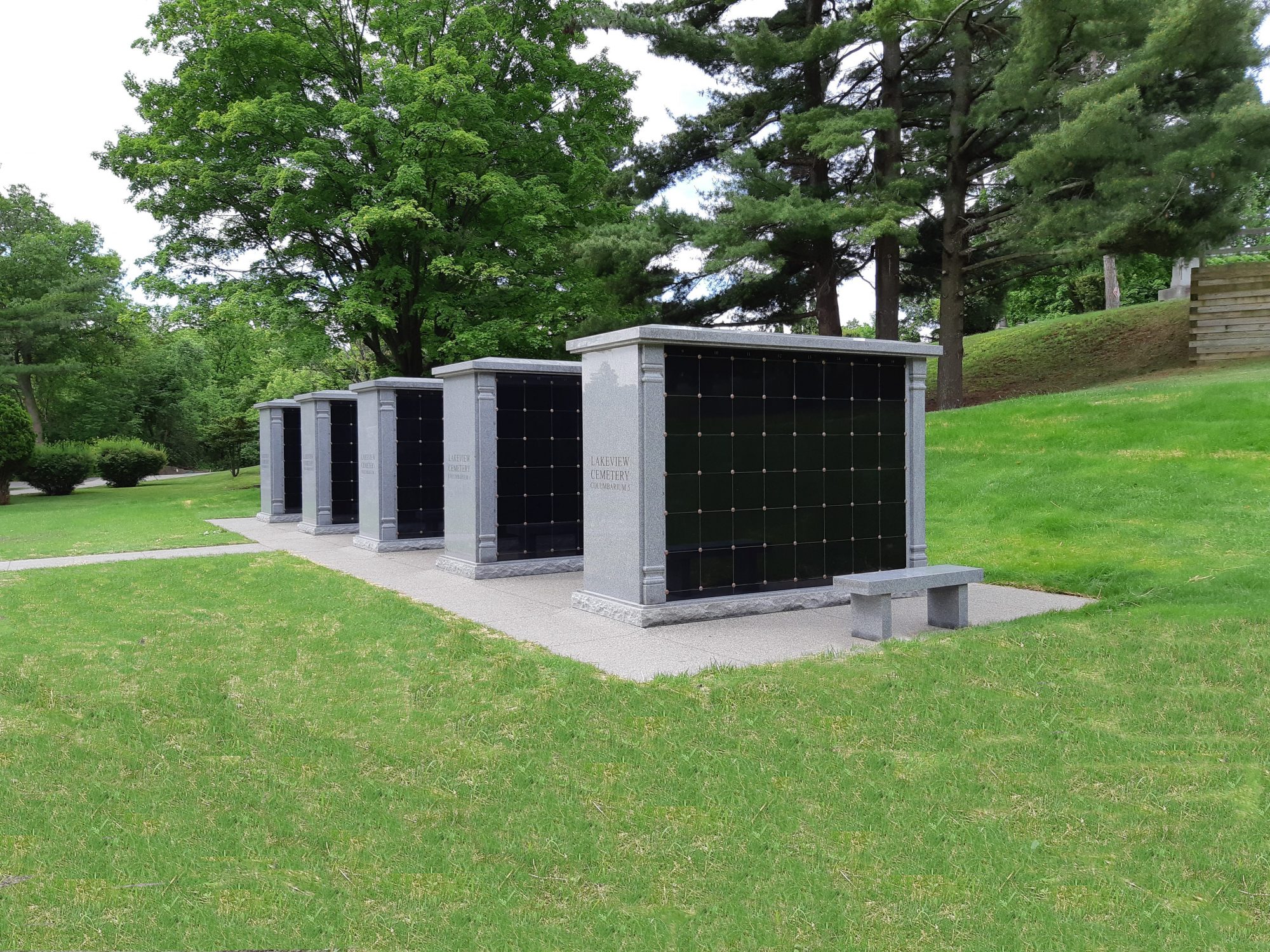 Rectangular 96 niche columbaria with added granite trim and sloped roofline